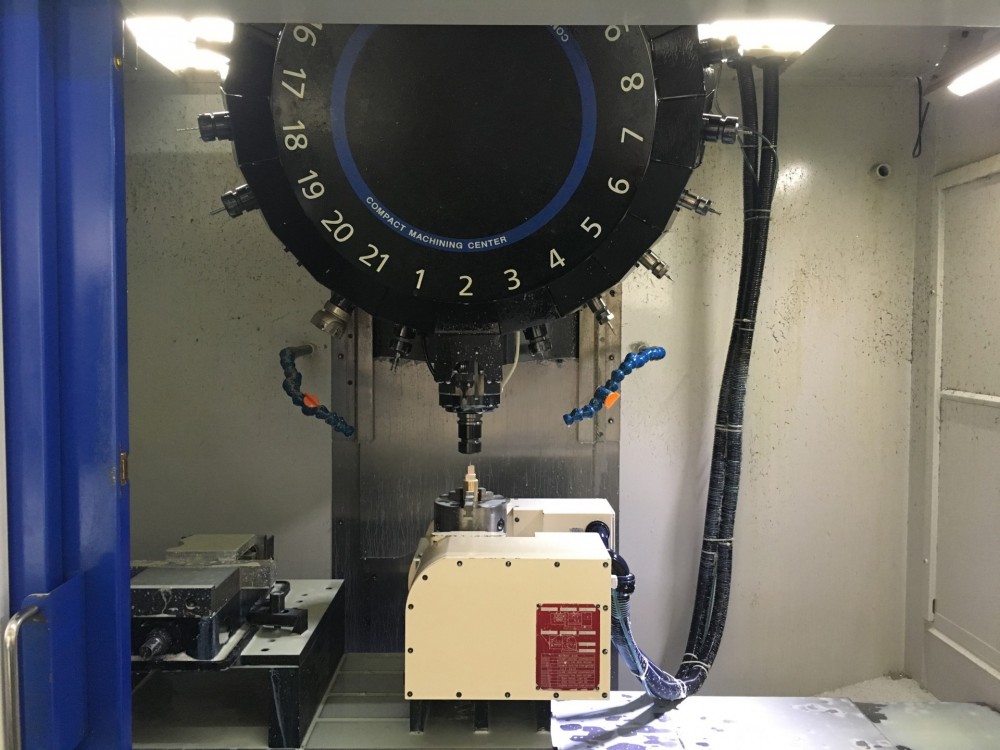 Four-axis CNC machining center